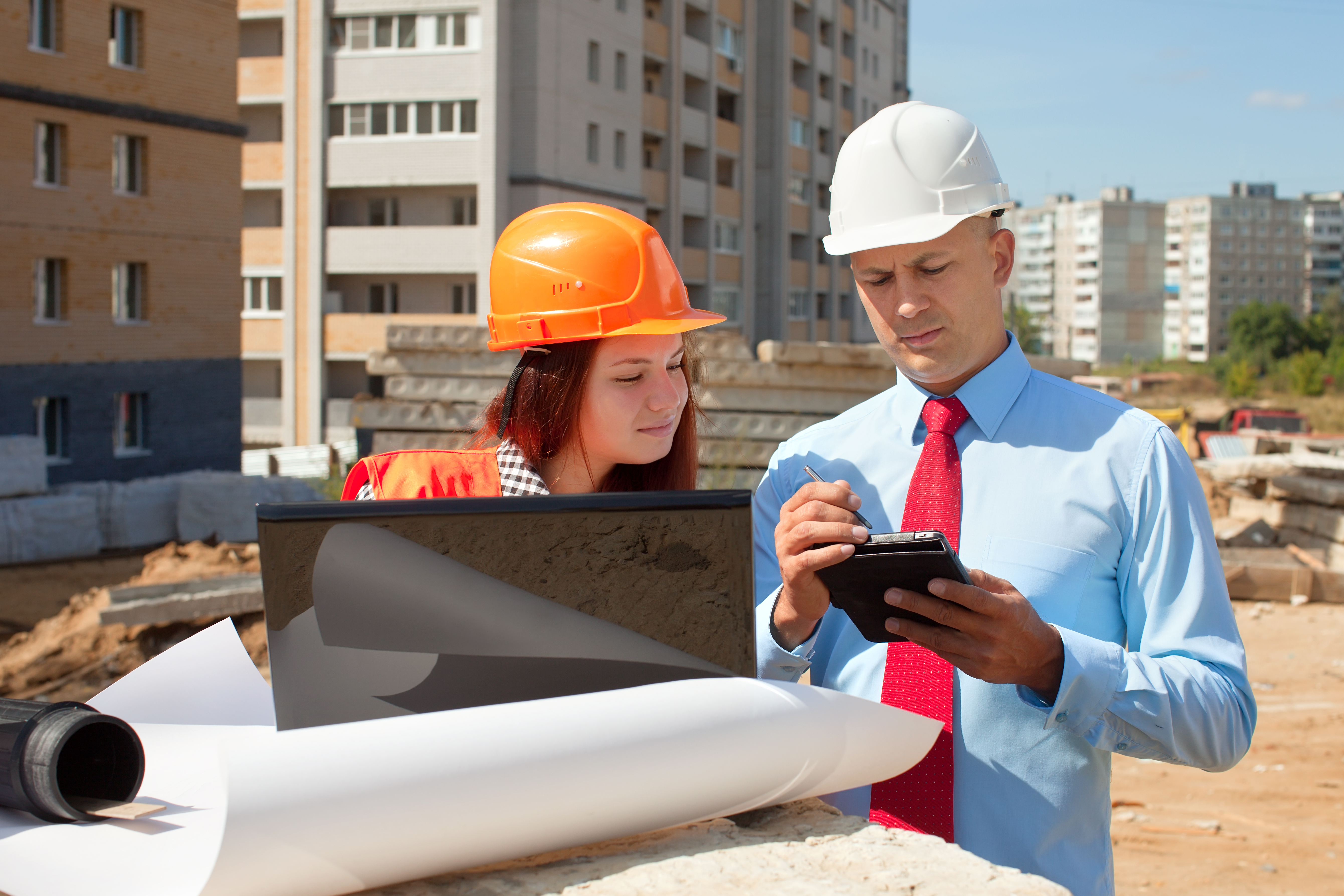 two architects front building site